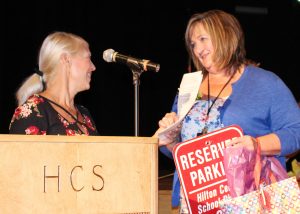 Heidi Barrett (left), teaching assistant, presents Beth Eichas, teacher’s aide at Hilton High School, with the Hilton Central School District School-Related Professional of the Year Award. Provided photo 