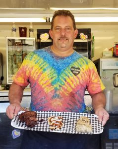 Tim Wandtke proudly displays some of his Belgian food specialties at the “Belgian Love” concession trailer on Brockport’s Main Street. Photo by Dianne Hickerson