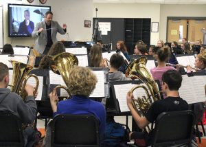 Composer James Stephenson listens via Skype as the Churchville-Chili HS band, directed by Terry Bacon, rehearses his piece “Deep Dish.” Provided photo