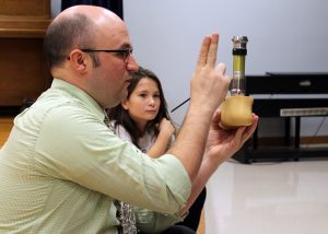 Sean Zeller, certified prosthetist/orthotist, explains how a prosthesis works as his patient, Northwood fourth grader Juliana Turner, watches. Provided photo