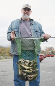 Pete McElhatten with a nice mess of fall run perch taken in Irondequoit Bay. Provided photo