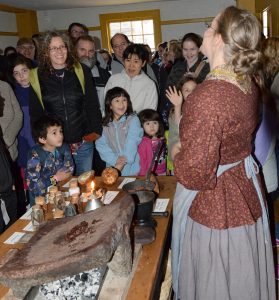 Preparing chocolate specialties brings a roomful of smiles during Genesee Country Village & Museum’s Preparing for the Holidays program on November 18. Provided photo