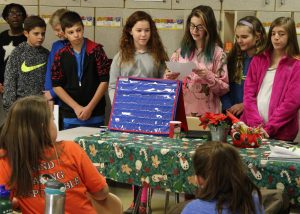 Each team of MS students chose their own approach to the subject of composting, and then discussed its findings with small groups of elementary school children. Provided photo
