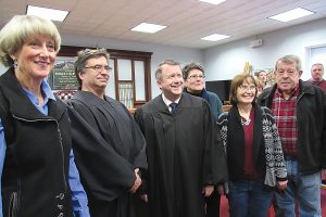 The swearing-in was well attended.  Martin noted the support he has received from other local officials and justices.  He is pictured here with (l-r)  Tony Perry, newly elected Sweden Town Justice, William Andrews, Jr., Brockport Village Justice, Brockport Village Justice Chris Martin, Robert Connors, Sweden Town Justice, and Dan Barlow, Town of Parma council member. Photo by Kristina Gabalski