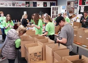 Students from Village Elementary School and the Best Buddies Club sorted donated food for the Hilton-Parma Emergency Food Shelf at the Hilton Community Center. 