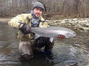 Captain Jeremy Sage with a fantastic steelhead that chowed a fresh egg sac under a float. Fresh bait is the key to fooling these finicky trout. Provided photo