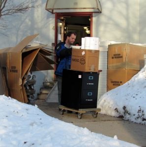 A moving company employee removes a filing cabinet and boxes from the former Brockport Village Hall at 49 State Street Wednesday morning, January 10. The village offices moved to a new location at 127 Main Street to make more room for the village court.