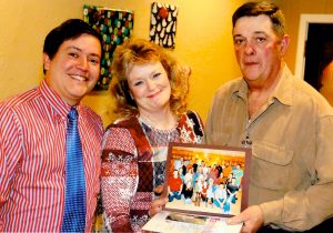 St. Leo Grand Knight Jose Rivera (left) presents the 2017 “Family of the Year” award to Sue and John VerWulst.
