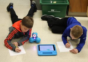 The spirit of inquiry rules for fourth-graders who are learning how to program robots to travel in geometric shapes, such as squares and acute triangles. Provided photo