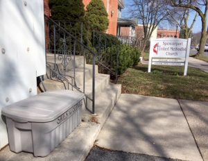 The collection bin is located beside the church’s front steps. Provided photo