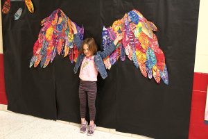 Selfie walls with hearts, butterflies and wings invited viewers to become part of the artwork.