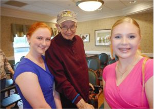 Anastasia’s Spotlight dancers Cate Hammond and Madison Dowd with Westwood Commons resident John DeBack. 