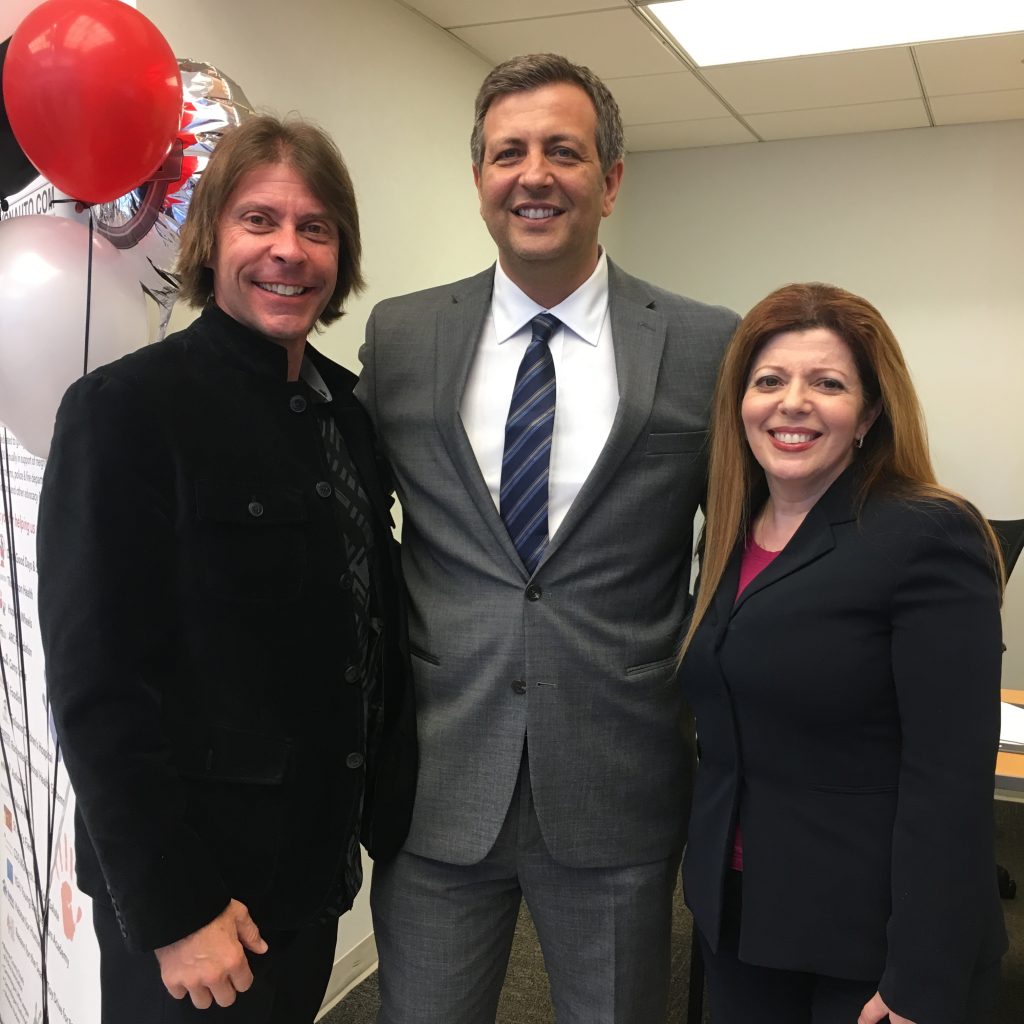 Vision Nissan Greece Owner Daniel Edwards and Partner Mario Marino with Greece Regional Chamber President & CEO Sarah Lentini at Vision's recent Grand Opening in Greece