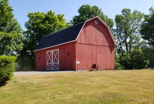 At 4988 Lake Road South an historic barn stands behind the Sweden Farmers Museum. The museum is located in a circa 1820s farmhouse (not shown). The barn dates to the late 1880s. Both are owned and maintained by the Town of Sweden. The museum was established in 2005 to preserve the Town’s agricultural history and provide education and celebration about the successes and importance of local farming. Photo by Dianne Hickerson 