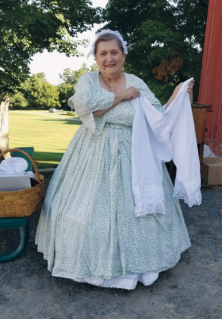 Leanna Hale, Town of Clarkson historian, wears a dress fashioned from the Civil War era. The day was too hot for her to wear her bloomers, she said.