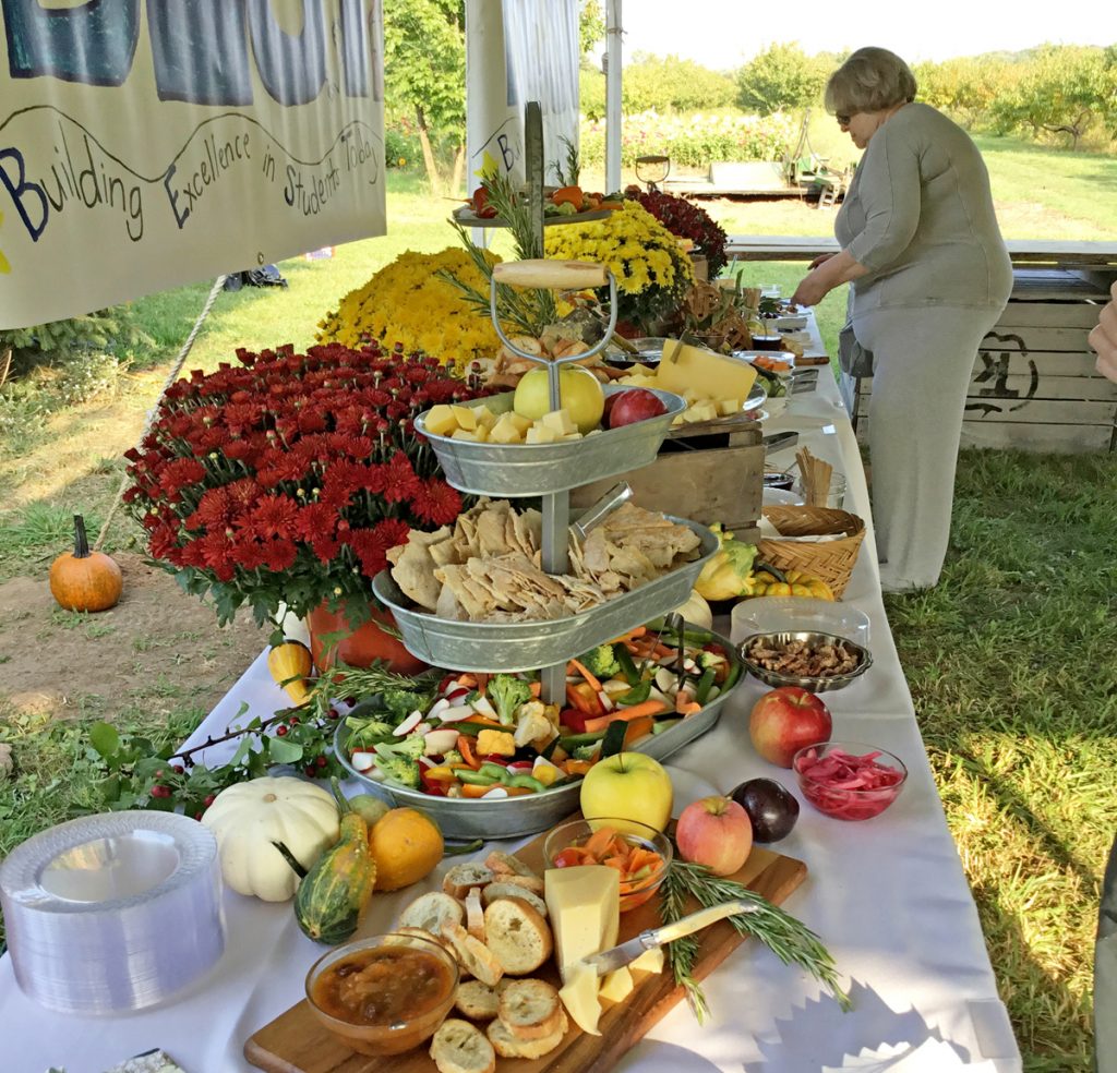 Last year’s “Farm to Table Fundraiser” at Kirby Farms had generous offerings from the land seen in the background. Submitted photo