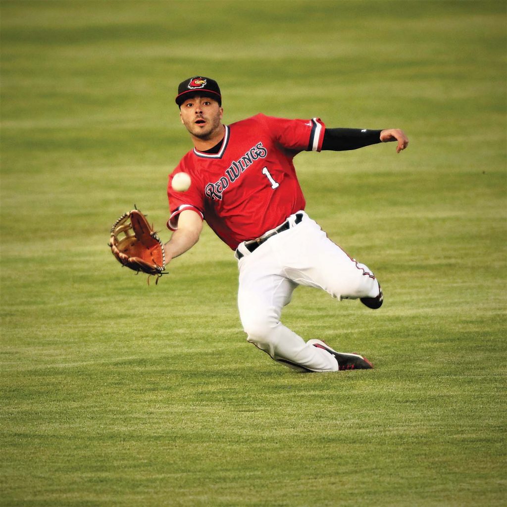 This picture of Zack Granite is an example of peak action, the ultimate in sports photography. Territo said, “I love shooting from a high angle onto the field. I always consider the background in these action pictures. I don’t want any confusion that comes with things going on in the background. I isolate the subject and feel the green with the bright red of the uniform creates a beautiful picture.” 