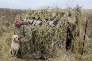  Veteran waterfowler Jim Miller and rookie retriever Rosalee (aka the White Kraken) with a nice bunch of tasty mallards. Provided photo