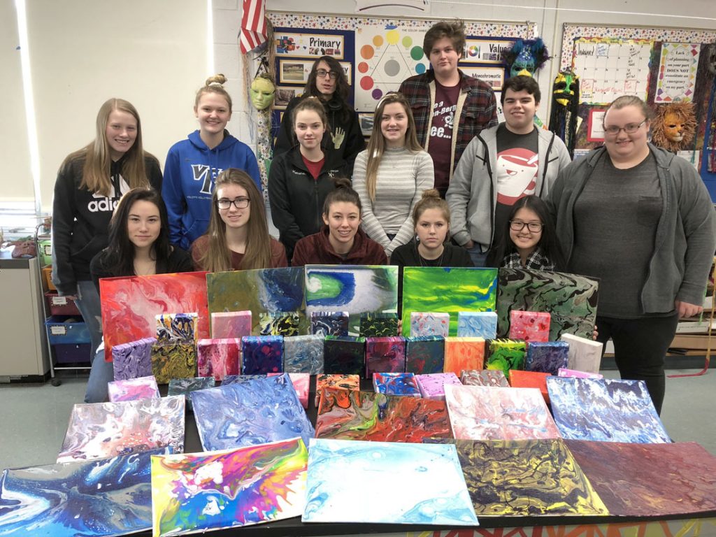 Eclectic Arts class with acrylic pour paintings. Photo by Sandy Auer