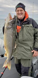 Jody Button of Fairport with a beautiful Lake Erie ... lake trout.