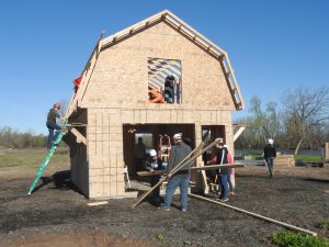 Students in Holley CSD’s Geometry in Construction class combined their math and construction skills in May to build a 16-foot by 20-foot barn for Homesteads for Hope, the non-profit community farm located in Ogden. 