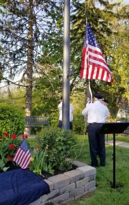 A color guard raises flags at the Veterans’ Memorial Park during the May 23 event. Photo by Dianne Hickerson.