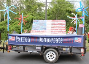 The float carries a US flag constructed of 126 boxes of cereal. 