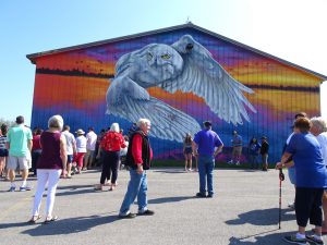 A landmark mural by artist Justin Suarez, located on the highway garage building between Hamlin Town Hall and the Public Library, was officially presented to the Hamlin community. 