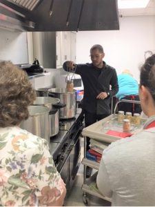 Orleans County Master Food Preserver Colin Butgereit shows participants how to place jars in a pressure canner. Colin has been the lead instructor for the Orleans County MFP Pressure Canning workshops for the past four years.