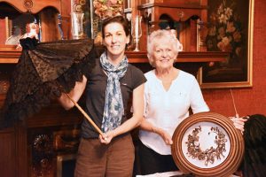 Rozenn Bailleul-LeSeur and Sue Savard show artifacts to be displayed at the Morgan-Manning House. 