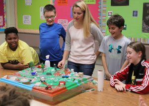 Each student demonstrated how a different kind of pollution entered the environment and accumulated in the local water supply.
