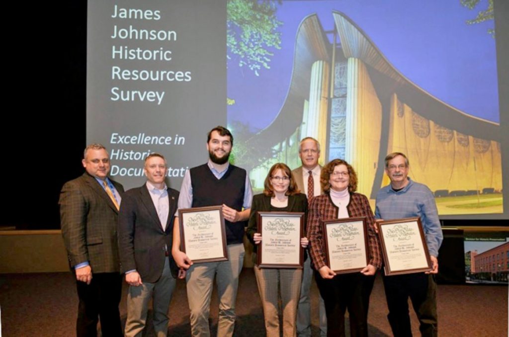 Shown, left to right: Daniel Mackay, NYS Deputy Commissioner for Historic Preservation; Wayne Goodman, Executive Director, The Landmark Society of Western New York; Christopher Brandt, Architect, Bero Architecture, PLLC; Katie Eggers Comeau, Architectural Historian, Bero Architecture, PLLC; Erik Kulleseid, New York State Commissioner of the Office of Parks, Recreation and Historic Preservation; Gina DiBella, Historic Preservation Consultant; Bill Sauers, President, Greece Historical Society.