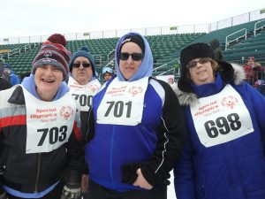 L-R: Patricia Van Savage, Kerri Patrick and Michelle Markham waiting for the next race. Van Savage has been a participant in the Special Olympics for 45 years.