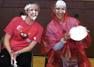 PE teacher Bethany Matsko (l) and Assistant Principal Renee Mulrooney (r) wear their whipped cream with pride.