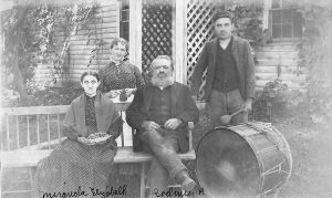 The Odell family photographed in front of their home at Parma Center. Shown (l-r) are: Miranda Knox Odell, Violet, Rodney Putnam Odell, and John Knox Odell.